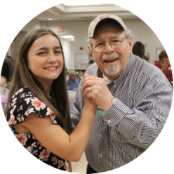 a volunteer and client dance
